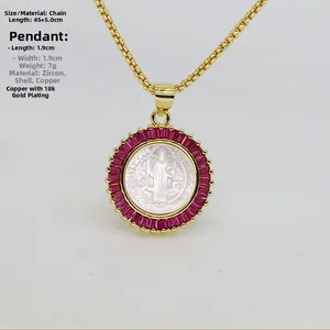 Detail view of 18k gold plated necklace with pink zircon and shell relief pendant