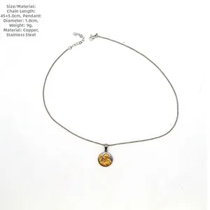 Detail view of round religious saint pendant with dimensions 1.8cm and 45cm chain length