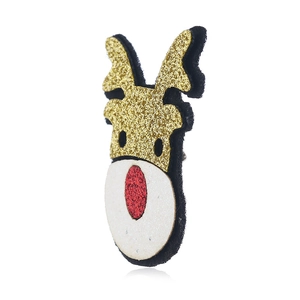 Detail view of a vintage fabric Christmas reindeer brooch with gold and red glitter accents