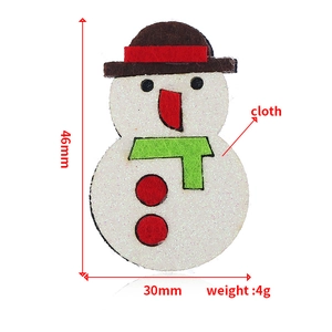Detailed view of handmade fabric snowman brooch with size markings 46mm by 30mm