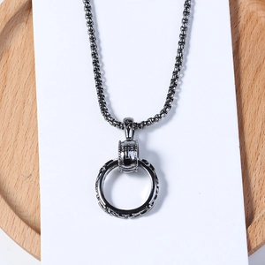 Men's vintage long chain necklace featuring a dark gun-metal engraved circle pendant