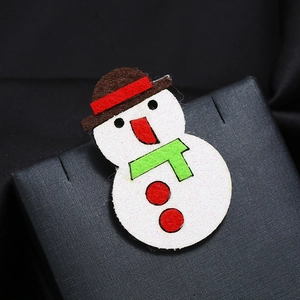 Christmas snowman fabric brooch with top hat and scarf on a premium black gift box