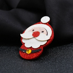 Vintage red fabric Santa Claus brooch with glitter details and yellow crystal on black velvet
