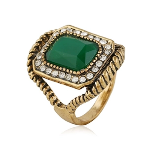 Vintage gold men's ring featuring rectangular green stone and crystal halo on white background