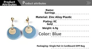 Detail showing blue Morandi round earrings with Love engraving and gold plated alloy hooks