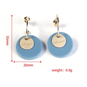 Detail showing retro Morandi round earrings size 35mm by 20mm with gold Love plate
