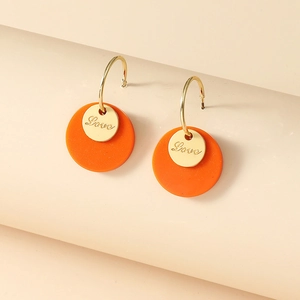 Elegant gold round hoop earrings with orange pendants and Love engraved discs