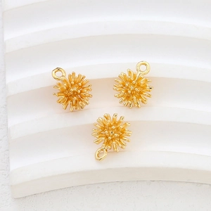 Macro shot of 14k gold-plated 3D bayberry ball pendants for DIY jewelry making and crafts