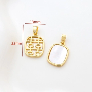 Detailed macro of 14k gold shell pendant showing 13mm x 22mm size and carved motif