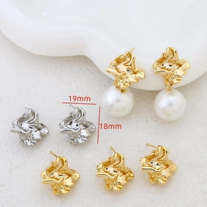 Macro view of irregular gold texture earrings showing dimensions of 19mm and 18mm