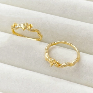 Macro detail of gold plated vine tree branch rings with pearl DIY mounting settings