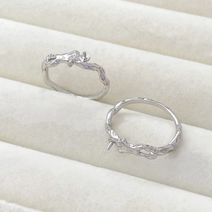 Detail of silver liquid metal texture ring base with peg for DIY pearl mounting