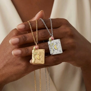 Vintage book-shaped locket necklace with rose and moon designs in gold and silver