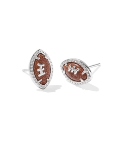 Detailed view of silver football stud earrings with shimmering brown stone and stitch details