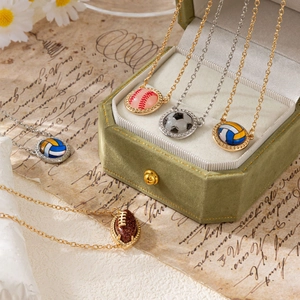 Retro sport theme necklaces featuring baseball and soccer pendants with sparkling crystals