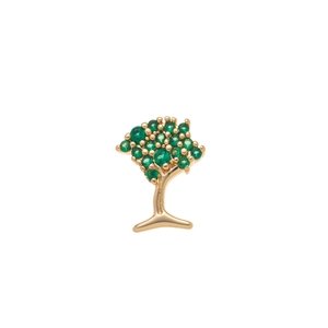Détail d'un pendentif arbre doré orné de zircons verts et de finitions précises