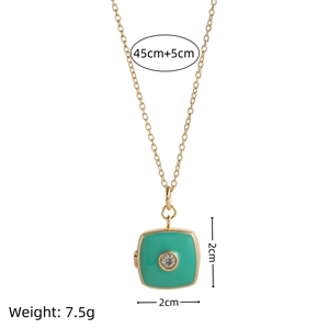 Gold chain necklace featuring a square turquoise enamel pendant with a central rhinestone