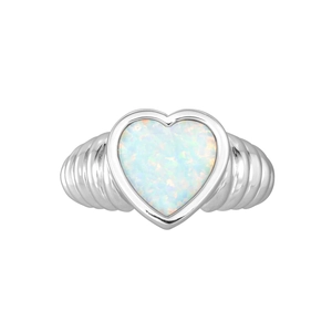 Detail of a silver-toned ribbed ring featuring a heart-shaped opal with rainbow fire