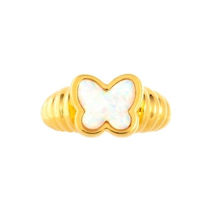 Macro detail of gold plated butterfly ring with rainbow opal wings and textured band