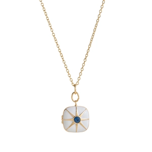 Detailed macro view of square gold locket with white enamel and blue gemstone