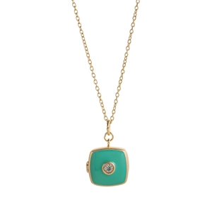 Detail showing gold locket pendant with mint green enamel and central zircon on chain
