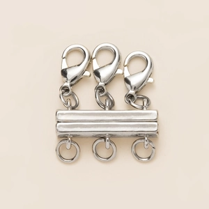 Detailed view of silver magnetic slide tube clasp for three-layer necklaces