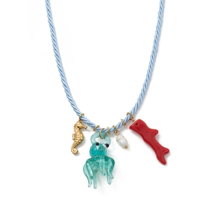 Detailed close-up of marine-themed necklace with starfish, seahorse and coral charms