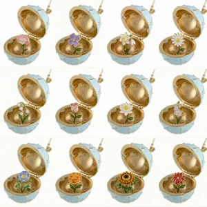 Collection of 12 light blue enamel egg-shaped flower lockets with gold plating detail