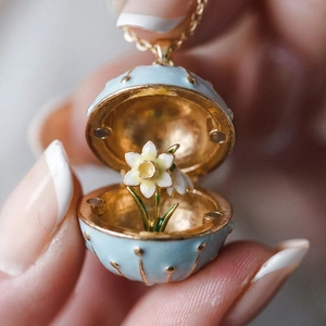 French vintage egg locket necklace in light blue enamel with blooming inner flower
