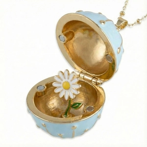 Light blue enamel Fabergé style egg necklace with a white daisy inside gold finish