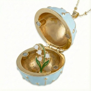Light blue enamel egg locket necklace with miniature lily of the valley flower inside