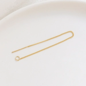 Detail of 14K gold-plated threader earring chain with needle and small loop for DIY jewelry