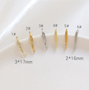 Detailed close-up of 14k gold plated U-shaped ear hooks with zircon insets for DIY jewelry