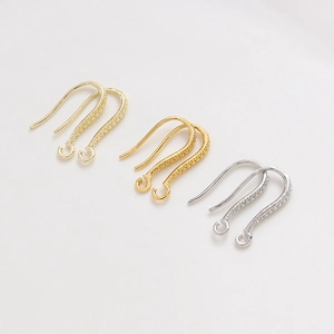 U-shaped gold-plated earring hooks with textured surface in gold, silver, and rose gold