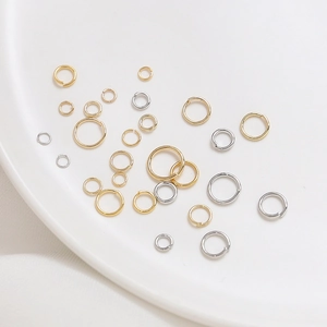 Polished gold and silver jump rings in various sizes for DIY jewelry making and crafts