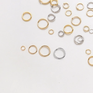 Golden and silver plated open jump rings in various sizes for jewelry making