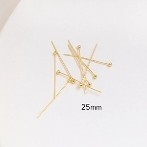 Detailed macro view of 25mm gold plated ball head pins for DIY jewelry making