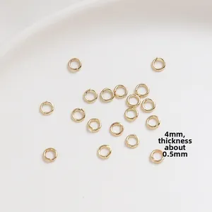 Macro detail of 4mm gold-plated jump rings with 0.5mm thickness for DIY jewelry making