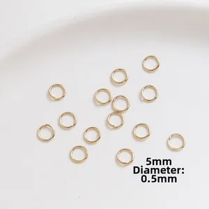 Detailed view of 5mm gold plated jump rings for jewelry making with 0.5mm thickness
