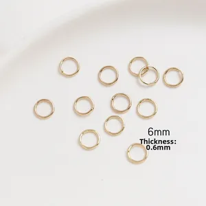 Macro detail of 6mm gold plated open jump ring with 0.6mm thickness for jewelry making