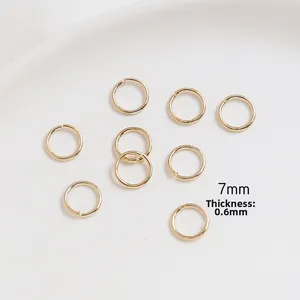 Detailed view of 7mm 14k gold-filled open jump rings with 0.6mm thickness for DIY jewelry