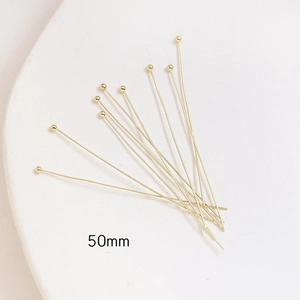 Detailed view of 50mm gold-plated ball head pins for professional DIY jewelry making