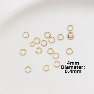Macro shot of 4mm gold-plated open jump rings with 0.4mm thickness for DIY jewelry