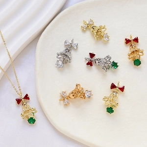 Christmas bell pendant in 14k gold plated copper with zircon and bow details
