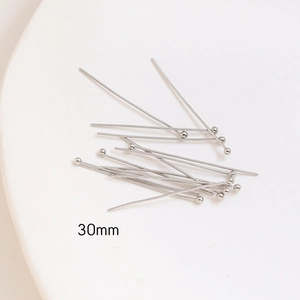 Macro detail of 30mm silver ball headpins for DIY jewelry making and bead work