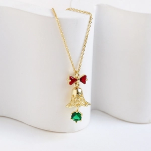 14k gold plated Christmas bell necklace with red bow and green gemstone pendant
