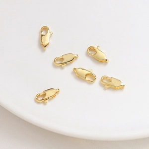 Detailed view of six 14K gold plated lobster clasps for DIY jewelry making