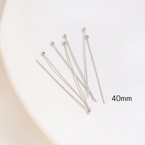 Macro shot of 40mm silver ball head pins for jewelry making and DIY handicraft projects