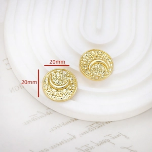Detailed view of 20mm hammered gold plated pendant with crescent moon and engraving