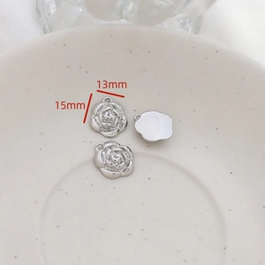 Macro detail of silver rose charm showing 15mm size and 3D floral carving for DIY jewelry